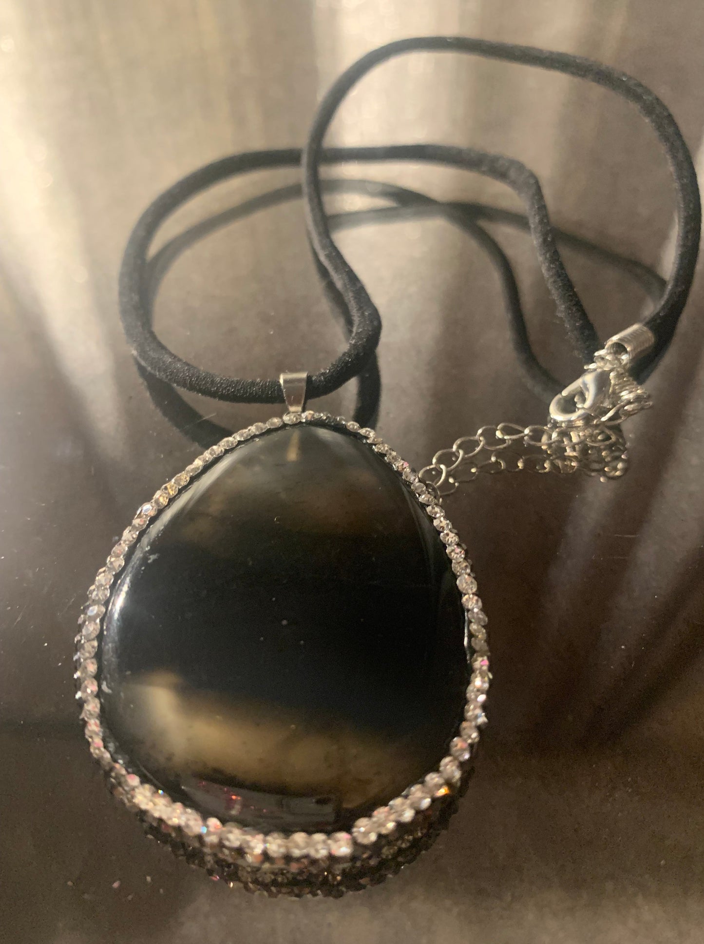 Necklace, Reversible Mirrored Smoke Pendant Trimmed in Rhinestones with Black Nylon Chocker Cord 14" Necklace with lobster clasp and extension chain.