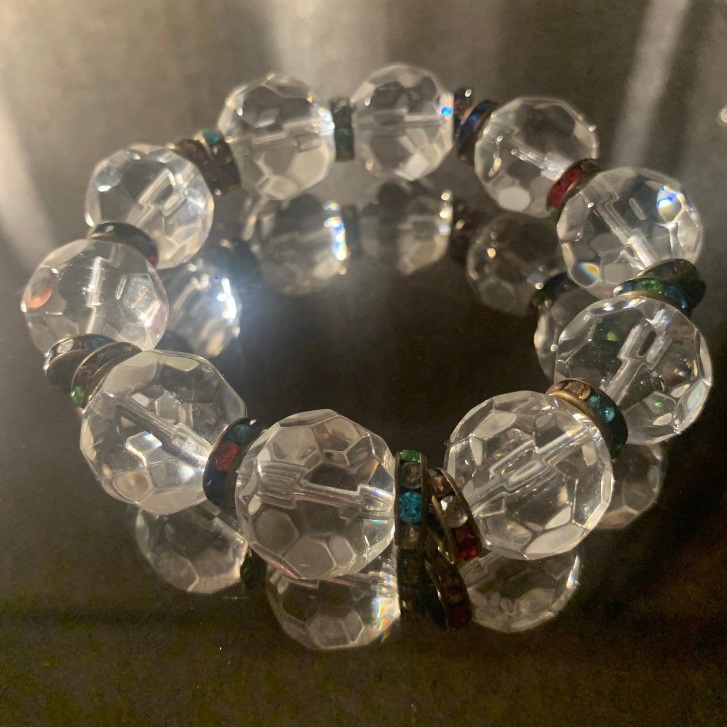 Bracelet/Large Clear Crystal Beads, Accented with Multi Colored Metal Bling Spacers.