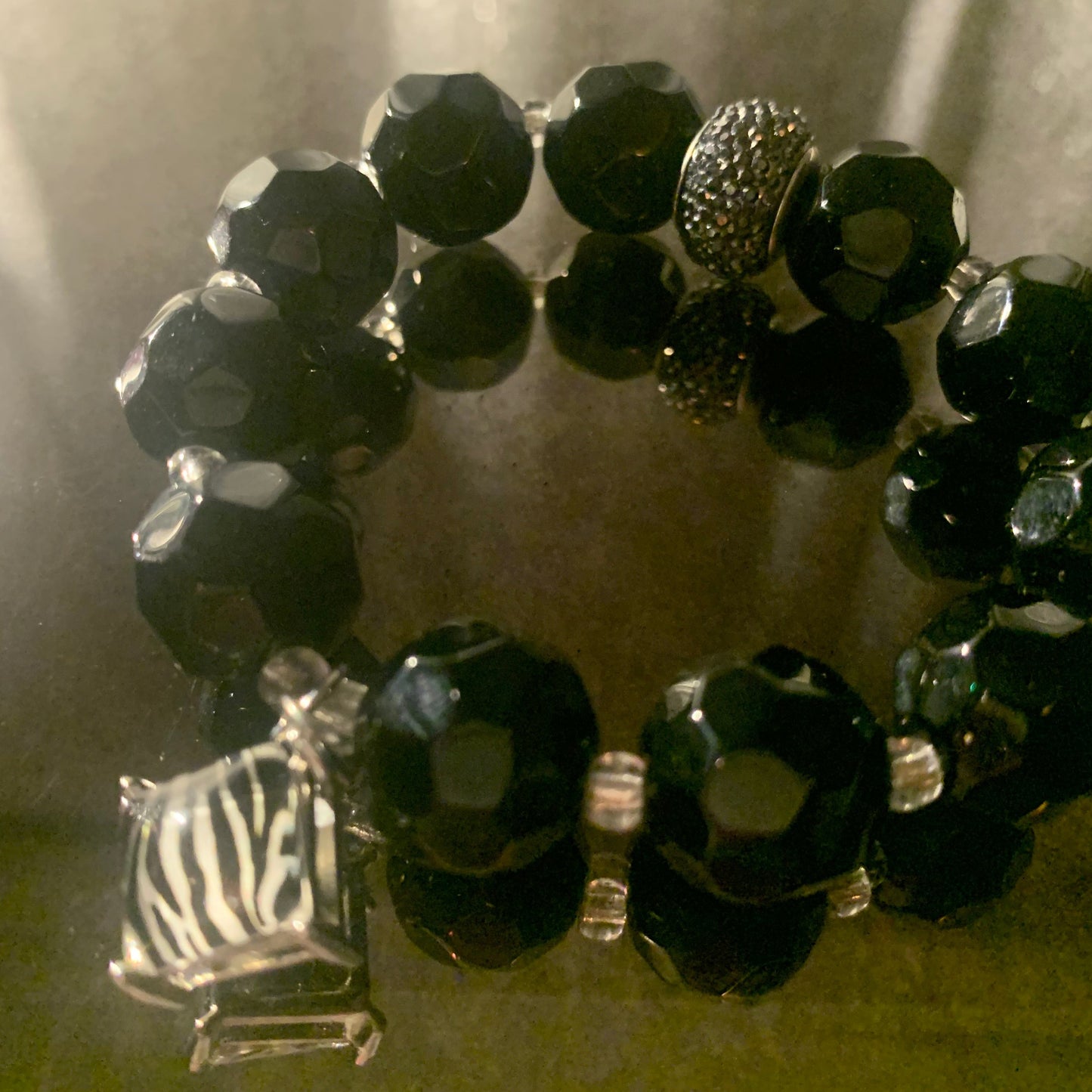 Bracelet/Stylish Black Crystal Glass Beads, Accented with Zebra Print Charm, Clear and Pave Spacers.