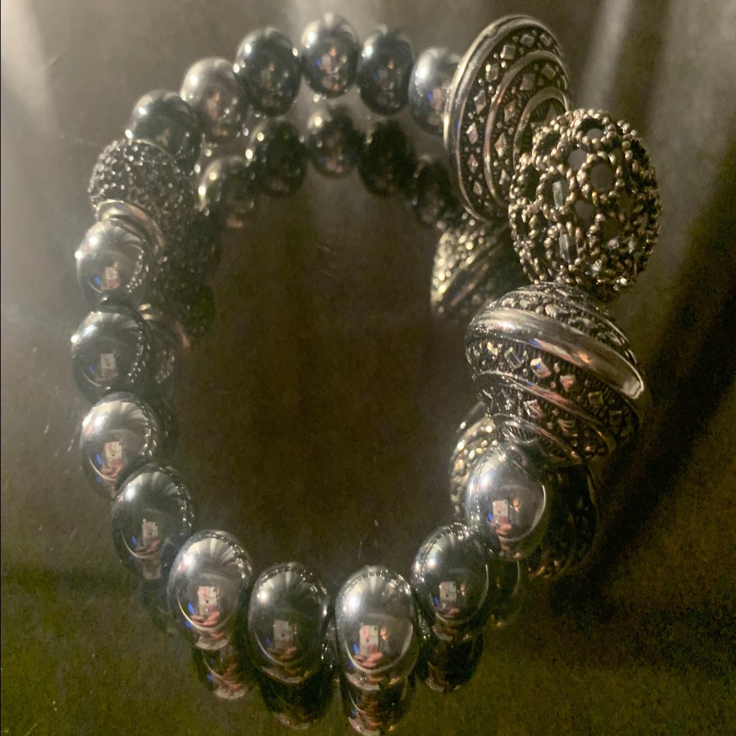 Bracelet/Fashion Statement Two-Tone Silver Metal Beads, Accented with Ethnic Charms, and Pave' Spacer.